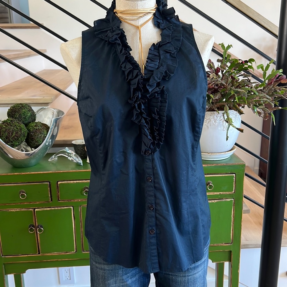 Sleeveless, ruffled blouse